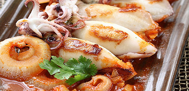 A table : calamars farcis à la panzetta et au prisuttu